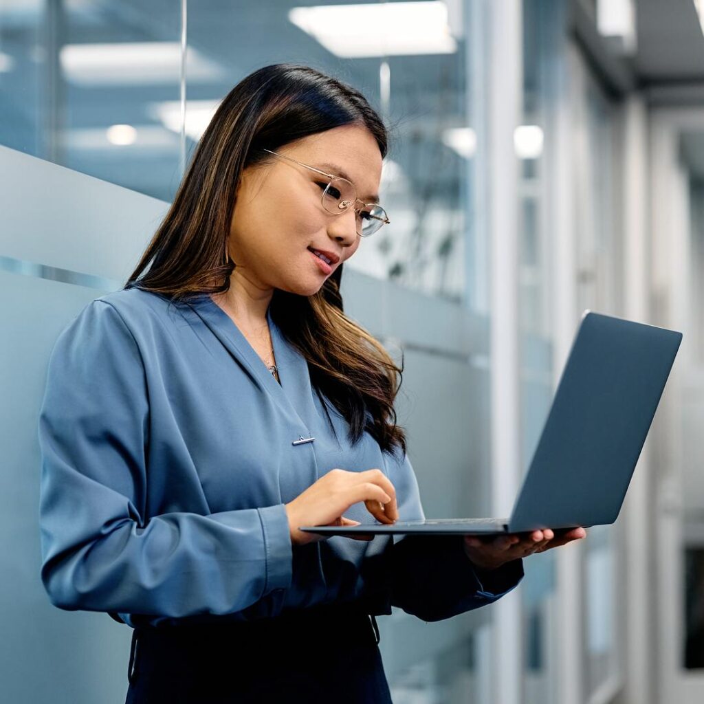 Businesswoman on laptop in office