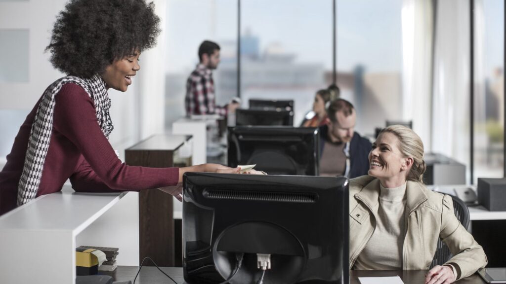 Co workers on computers with no IT issues