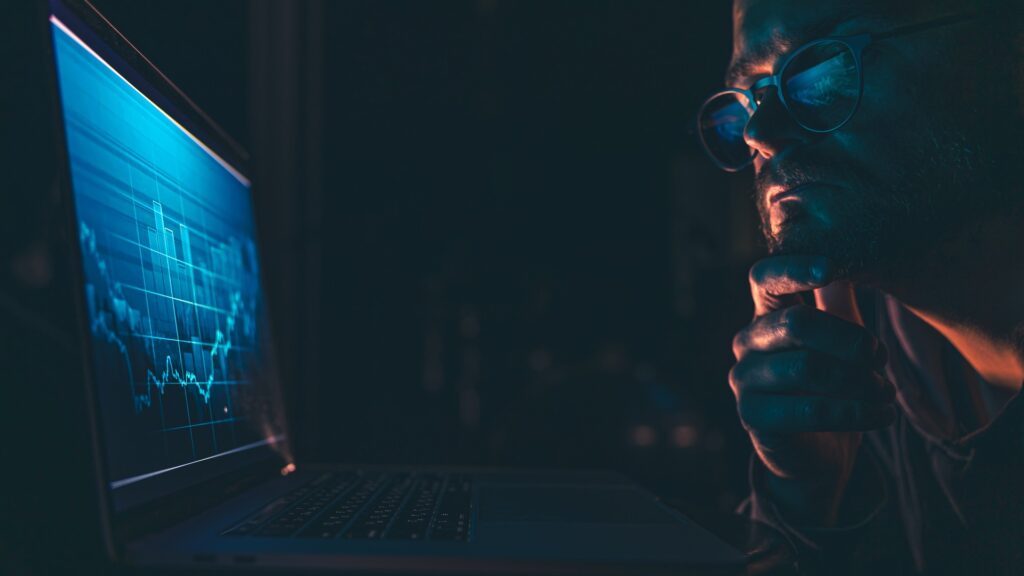Cyber attacker looking at computer